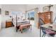 Bright bedroom with a large window and tall ceiling, featuring wooden furniture at 1585 Hecla Way # 304, Louisville, CO 80027