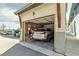 View of the one car garage with a Lexus parked inside at 1585 Hecla Way # 304, Louisville, CO 80027