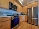 Well-equipped kitchen featuring stainless steel appliances, plenty of cabinets, and a quartz countertop at 1585 Hecla Way # 304, Louisville, CO 80027