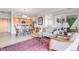 Inviting living space with a dining area, with a modern kitchen visible in the background at 1585 Hecla Way # 304, Louisville, CO 80027