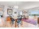 Open-concept living and dining area with hardwood floors and an abundance of natural light at 1585 Hecla Way # 304, Louisville, CO 80027