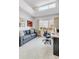 Bright office space with large window, sofa, desk, and comfortable chair at 1585 Hecla Way # 304, Louisville, CO 80027
