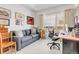 Inviting office space with a comfortable sofa and a large window at 1585 Hecla Way # 304, Louisville, CO 80027