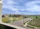 Nice street view from the balcony showing trees and well-manicured lawns at 1585 Hecla Way # 304, Louisville, CO 80027