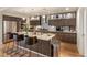 Modern kitchen with a large kitchen island, stainless steel appliances, and hardwood floors at 410 Acoma St # Brownstone 3, Denver, CO 80204