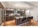 Kitchen with a large island, stylish cabinets, stainless steel appliances, and a granite countertop at 410 Acoma St # Brownstone 3, Denver, CO 80204