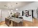 Kitchen with granite countertops, hardwood floors, stainless steel appliances, and views to dining area at 410 Acoma St # Brownstone 3, Denver, CO 80204