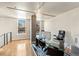 Bright modern office space featuring a glass desk, stylish chair, and large windows at 410 Acoma St # Brownstone 3, Denver, CO 80204