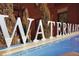 Watermark community signage at 410 Acoma St # Brownstone 3, Denver, CO 80204