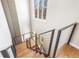 Modern staircase with sleek metal railings and wood steps, illuminated by natural light at 410 Acoma St # Brownstone 3, Denver, CO 80204