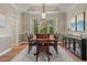 Elegant dining room features a tray ceiling, chandelier, and furniture for hosting dinners at 27290 E Nova Cir, Aurora, CO 80016