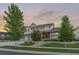 Charming two-story home with a three-car garage, beautiful landscaping, and inviting curb appeal at 27290 E Nova Cir, Aurora, CO 80016