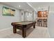 Spacious game room with a pool table, bar area, and ample room for entertainment at 27290 E Nova Cir, Aurora, CO 80016