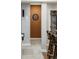 Hallway view featuring a dart board and bar area with a glimpse into the tiled shower of the bathroom at 27290 E Nova Cir, Aurora, CO 80016