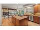 Kitchen with granite counters, stainless appliances and an island cooktop, open to Gathering room at 27290 E Nova Cir, Aurora, CO 80016