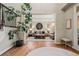 Open living area with hardwood floors and stylish decor creates an inviting and spacious atmosphere at 27290 E Nova Cir, Aurora, CO 80016