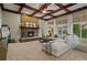 Spacious living room features stone fireplace, coffered ceiling, large windows and natural light at 27290 E Nova Cir, Aurora, CO 80016