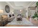 Bright living room with a large bay window, neutral decor, and hardwood floors creates a welcoming space at 27290 E Nova Cir, Aurora, CO 80016