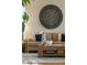 Cozy living room featuring a comfortable sofa, decorative wall art, and a stylish coffee table at 27290 E Nova Cir, Aurora, CO 80016