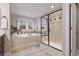Beautiful main bathroom with soaking tub, glass shower, and modern fixtures throughout at 27290 E Nova Cir, Aurora, CO 80016