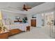 Bright main bedroom features neutral colors, a tray ceiling, and an open doorway at 27290 E Nova Cir, Aurora, CO 80016