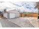 Single car detached garage with a large driveway at 1946 Rosemary St, Denver, CO 80220