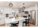 Modern kitchen with white shaker cabinets, island, stainless steel appliances at 1946 Rosemary St, Denver, CO 80220