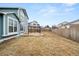 Backyard featuring a patio, playset, lawn, and fenced yard near a two-story house at 2080 S Danube Ct, Aurora, CO 80013