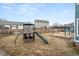 Backyard featuring a play structure and patio with room to play with the neighbor's house nearby at 2080 S Danube Ct, Aurora, CO 80013