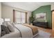 Inviting bedroom with a large window, neutral décor, and ample natural light at 2080 S Danube Ct, Aurora, CO 80013