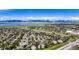 Expansive aerial view showcasing the community's lush green spaces, serene lake, and breathtaking mountain views at 9567 Brentwood Way # A, Broomfield, CO 80021