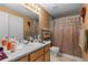 Standard bathroom with neutral tones, shower with curtain, and vanity at 9567 Brentwood Way # A, Broomfield, CO 80021