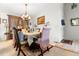 Elegant dining room featuring a chandelier, formal table setting, and natural light at 9567 Brentwood Way # A, Broomfield, CO 80021