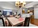 Formal dining room features an elegant chandelier and is adjacent to the living room and kitchen at 9567 Brentwood Way # A, Broomfield, CO 80021