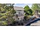 View of home featuring a balcony, siding, and surrounded by trees at 9567 Brentwood Way # A, Broomfield, CO 80021