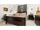 Main bedroom features a large bed, neutral carpet, and two matching nightstands at 9567 Brentwood Way # A, Broomfield, CO 80021
