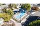 Community pool with clear water, sun loungers, and a bathhouse, perfect for relaxing and enjoying the outdoors at 9567 Brentwood Way # A, Broomfield, CO 80021