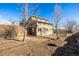 Exterior view of home with natural landscaping, mature trees, and a spacious backyard at 2541 Yarmouth Ave, Boulder, CO 80301