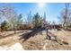 Spacious backyard with mature trees offers a serene outdoor living space at 2541 Yarmouth Ave, Boulder, CO 80301