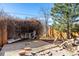 Backyard has a covered area, wooden deck, and a tree, under a bright blue sky at 2541 Yarmouth Ave, Boulder, CO 80301