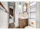 Bathroom features a single sink vanity, wood accents, and a shower at 2541 Yarmouth Ave, Boulder, CO 80301