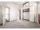 Bedroom with carpet, closet, and doorways to the hallway and bathroom at 2541 Yarmouth Ave, Boulder, CO 80301