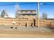 Exterior shot of the home showing the fence, mailbox and neighborhood at 2541 Yarmouth Ave, Boulder, CO 80301