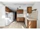 Cozy kitchen with tile floors, wooden cabinets, and essential appliances at 2541 Yarmouth Ave, Boulder, CO 80301