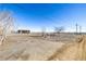 A view of the land, a house, and power lines under a clear, bright blue sky at 2541 Yarmouth Ave, Boulder, CO 80301