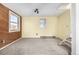 Spacious living room with two large windows, carpet floors, and access to the staircase at 2541 Yarmouth Ave, Boulder, CO 80301