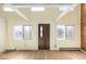 Bright living room with wood floors, large windows and a striking front door at 2541 Yarmouth Ave, Boulder, CO 80301