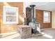 Cozy living room showcasing a wood-burning stove with a stone base at 2541 Yarmouth Ave, Boulder, CO 80301