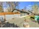 View of the fenced backyard and garage from outside the property at 505 S Roosevelt Rd, Lafayette, CO 80026