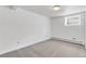 Unfinished basement with neutral carpet and trim, ready for customization at 505 S Roosevelt Rd, Lafayette, CO 80026